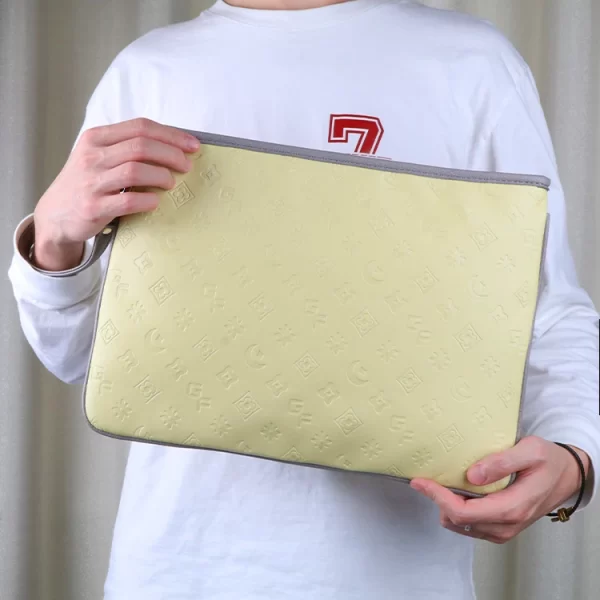 Elevate Your Style with the Embossed Yellow Small Computer Bag