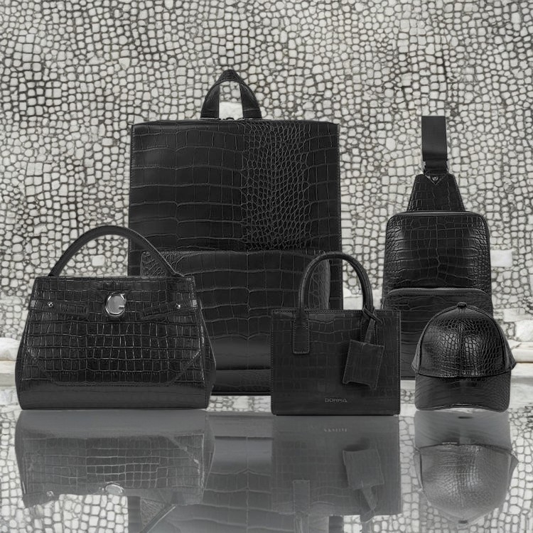 A collection of crocodile textured handbags and backpacks